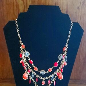 Red acrylic novelty beads on gold tone chain